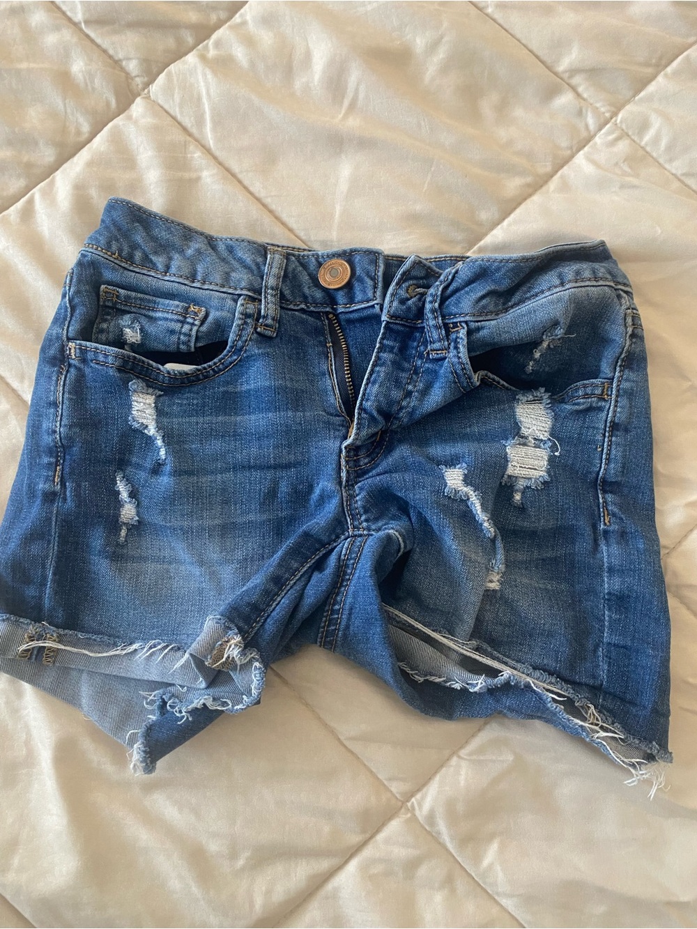 Blue distressed denim shorts